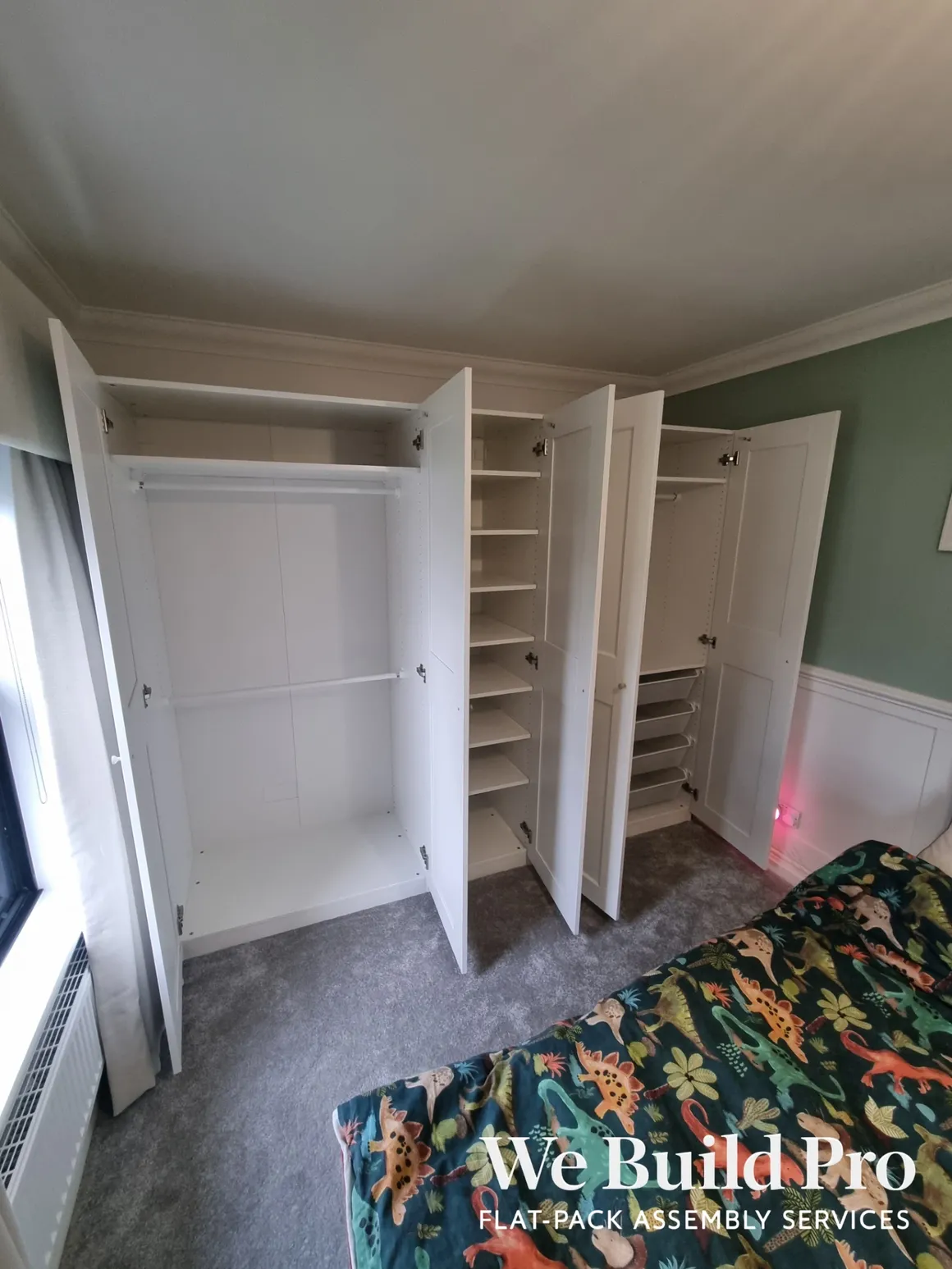 White built-in wardrobes with open doors showing organized interior storage